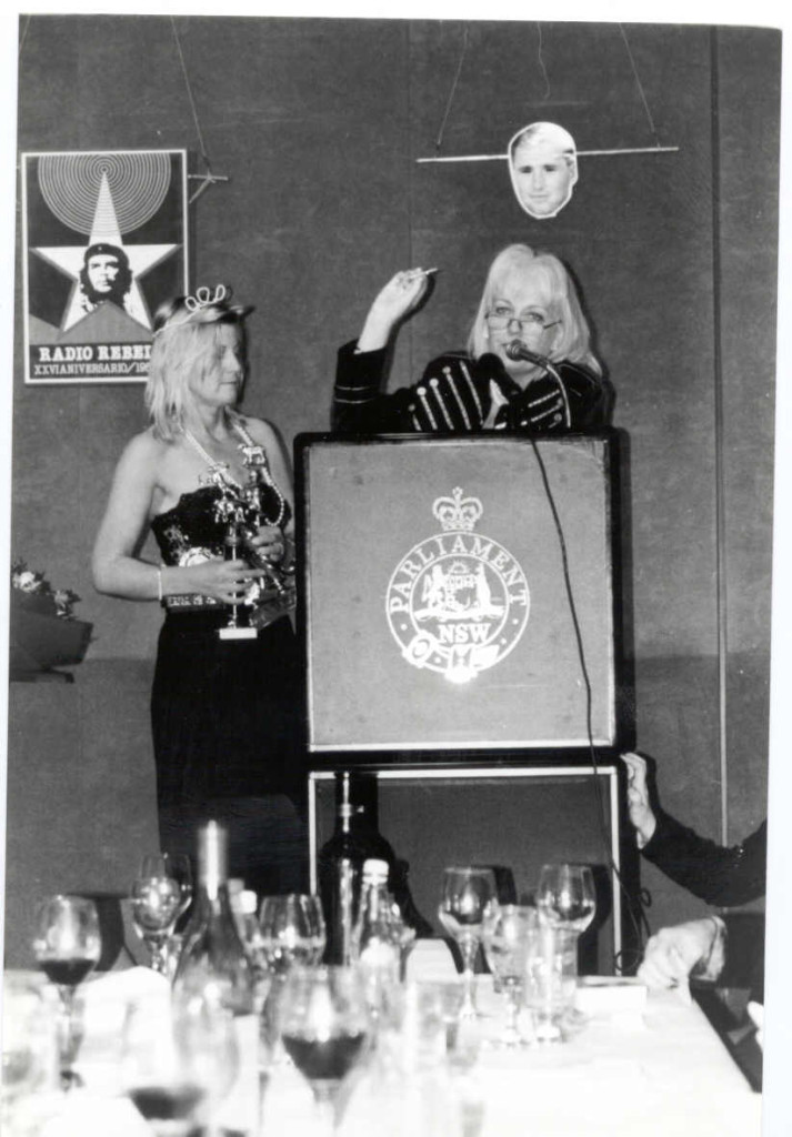 1999 Ernie Awards: Meredith hands out awards under the watchful eyes of her two heroes, Che Guevarra and Tony Lockett.