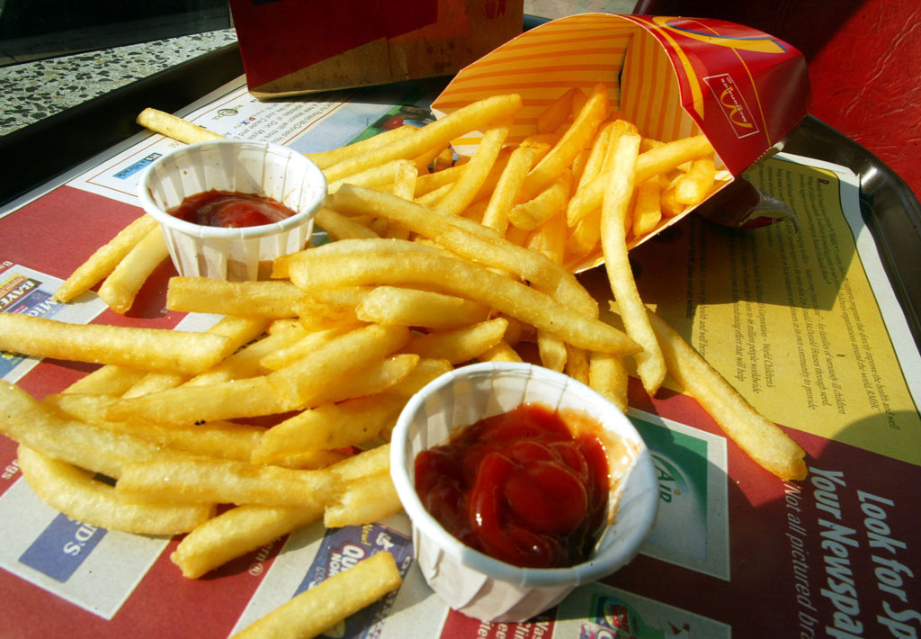 NEW YORK - SEPTEMBER 3: French fries are shown in a McDonald's restaurant on First Avenue September 3, 2002 in New York City. McDonald's announced plans to use a new cooking oil for its french fries that it says will cut in half the trans-fatty acid levels while increasing the amount of the more beneficial polyunsaturated fat. (Photo by Mario Tama/Getty Images)