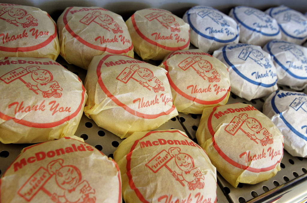 DES PLAINES, IL - APRIL 14: A wrapped cheeseburger and hamburger display sits inside the McDonald's USA First Store Museum April 14, 2005 in Des Plaines, Illinois. The McDonald's museum is a recreation of the first McDonald's restaurant opened at this location by founder Ray Kroc on April 15, 1955. The original red and white tiled restaurant was finally torn down in 1984 and the present facility was built according to the original blueprints with some modifications to accommodate visitors and staff. The customer service and food preparation areas contain original equipment and the all male crew is represented by mannequins dressed in the 1955 uniform of dark trousers, white shirts, aprons and paper hats. McDonald's will mark their 50th anniversary with an opening of a new restaurant in Chicago. (Photo by Tim Boyle/Getty Images)